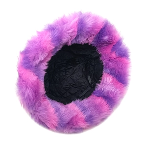 Detail of the warm black quilted lining and fluffy purple tie-dye plush bucket hat