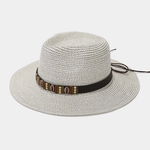 Flat top straw sun hat with bohemian shell band and leather strap in light beige color