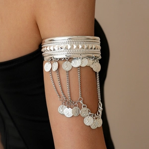 Bohemian silver multi-layer arm cuff featuring metallic fringe and coin pendant charms