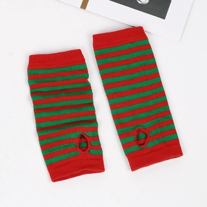 Detail of red and green striped knit arm warmers with thumb holes and elastic texture