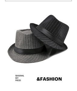 Close-up of grey and black striped wool felt fedora hats with elegant satin ribbon detail
