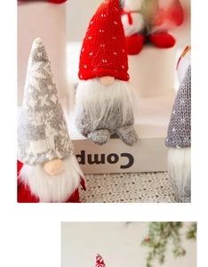 Detailed view of handmade Christmas gnomes with knitted hats and long white beards