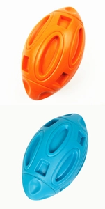 Close-up of durable rubber squeaky dog toy football with treat hole and non-slip texture
