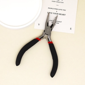 Detail of professional black and red needle nose pliers for DIY jewelry making crafts