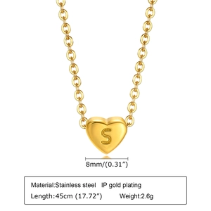 Detail view of a gold heart pendant with letter S engraving and 45cm stainless chain