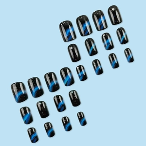 Black starry sky press-on nails with blue aurora finish and shimmering star patterns