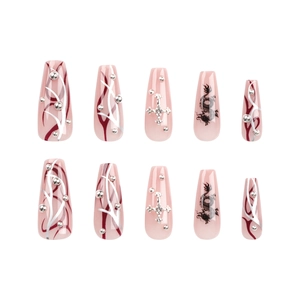 Y2K ballet press-on nails with dragon prints, crosses, and rhinestones in nude pink