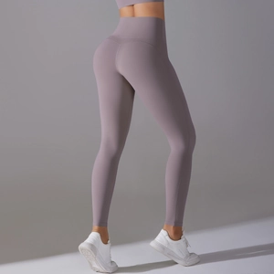 Close-up of high-waisted lavender yoga leggings showing peach butt lift and seamless fabric