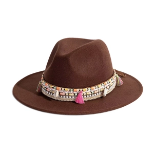 Detail of brown felt fedora featuring an ethnic woven band with beads and tassels
