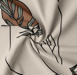 Macro detail showing soft fabric texture and leaf prints on Morandi tapestry cloth