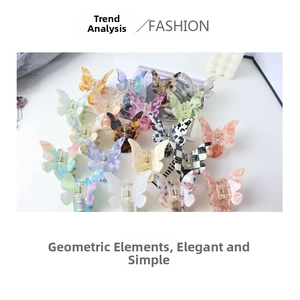 Detailed view of colorful acetate butterfly hair claws with checkerboard and marble patterns