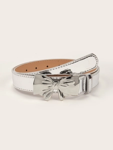 Detail of mirror silver bow buckle leather belt with adjustable holes for women