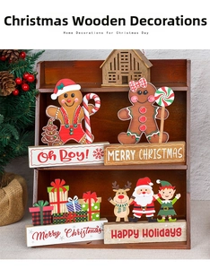 Detailed view of wooden Christmas gingerbread and Santa tabletop decor on a festive stand