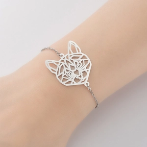 Minimalist silver stainless steel bracelet featuring a hollow geometric cat charm on a wrist