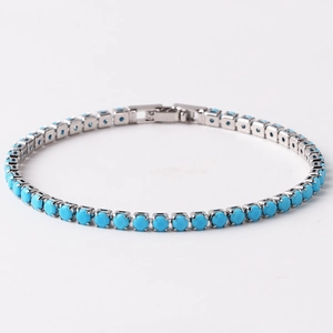 Elegant silver tennis bracelet with green square zircons and a secure fold-over clasp
