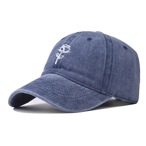 Vintage washed navy denim baseball cap featuring white rose embroidery decoration