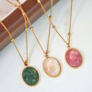 Three faceted natural stone pendant necklaces in green, pink and white on gold beaded chains