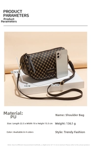 Detailed size measurement of the brown printed barrel bag with mobile phone for scale