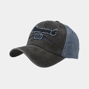Close-up of vintage washed denim baseball cap with New York 1983 embroidery details