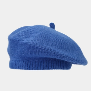 Detailed knit texture and top decorative pompom of this royal blue winter beret hat