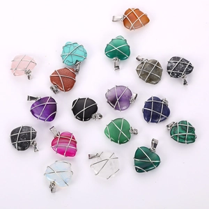Handcrafted heart-shaped crystal pendants wrapped in silver wire with natural stones