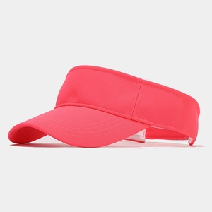 Detail shot of deep pink sun visor hat with curved brim and reinforced stitching