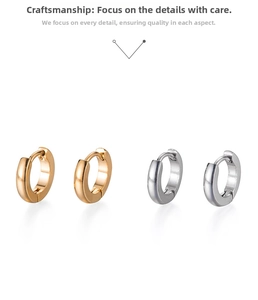 Detailed close-up of polished gold and silver hoop earrings with secure clasps