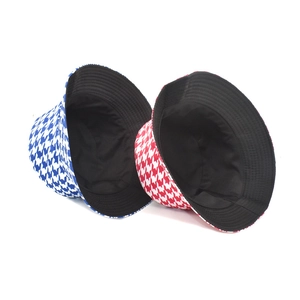 Reversible bucket hats with houndstooth star pattern in blue and red canvas fabric