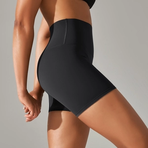 Detail view of high waisted black yoga shorts featuring butt lifting and slim fit design