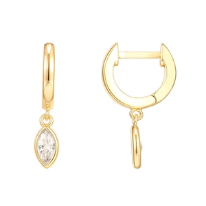Detail of gold earrings with marquise-cut clear gemstone charms on a white background