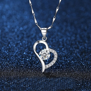 Macro shot of S925 sterling silver heart necklace with sparkling round zircon gemstone