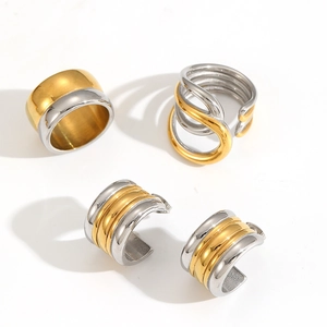 Two-tone minimalist stainless steel jewelry set featuring rings and striped hoop earrings