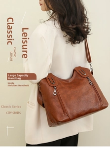 Brown leather shoulder bag for women showing large capacity and soft texture details