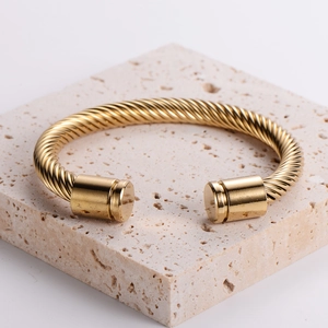 Men's 18K gold-plated stainless steel twisted cable open cuff bracelet on stone base