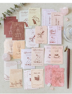 Flat lay of 30pcs vintage textured paper stickers with dried flowers and dip pen