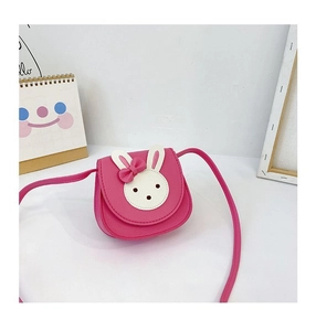 Close-up of pink PU leather kids crossbody bag with cute rabbit face and bow detail