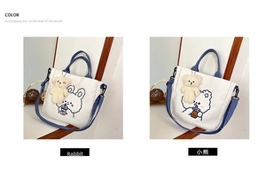 Detail view of canvas tote bag with cute bear and rabbit prints and blue straps