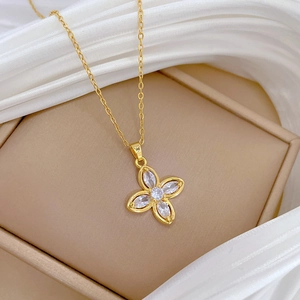 Lucky four-leaf clover pendant necklace in gold with sparkling white cubic zirconia