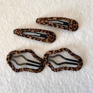 Leopard print fabric hair clip set including oval and wavy rectangle barrettes on white