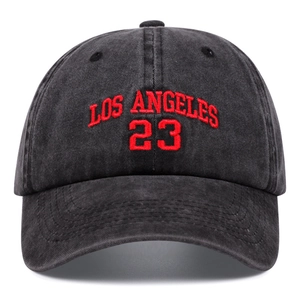 Vintage washed black cotton baseball cap with red Los Angeles 23 embroidery on white background