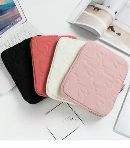Detailed stacked view of quilted rabbit tablet cases in black, red, white, and pink tones