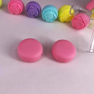 Colorful macaron and rose shaped plastic cosmetic cream jars for travel storage