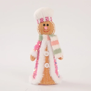 Pink and beige knit gingerbread man Christmas doll with sequins for festive decoration