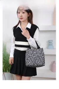 Detailed view of large nylon tote bag featuring a stylish grey leopard print pattern