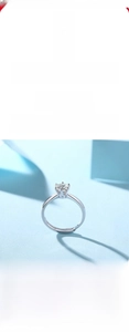 Macro shot of 925 silver six-prong moissanite ring with brilliant cut round stone