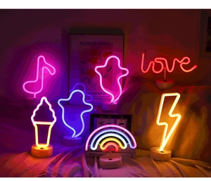 Neon LED mood lights with diverse shapes like music notes and ghosts on round bases