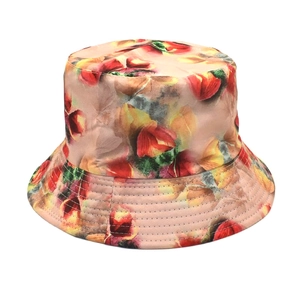Detail view of colorful floral bucket hat showing parallel stitching on canvas brim