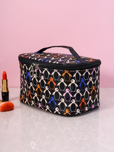 Detail of square toiletry bag with penguin prints and convenient top handle