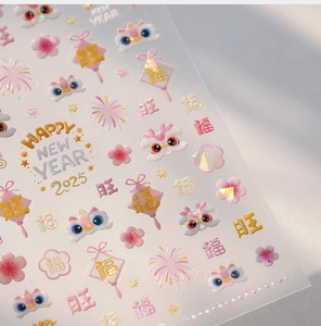 Macro detail of 2025 Lunar New Year nail stickers with laser lion and floral motifs