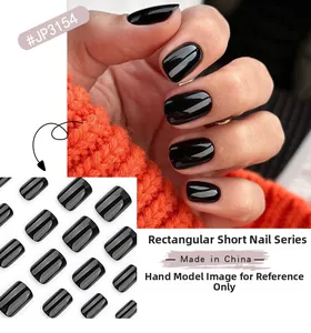 Detail of short square press-on nails in glossy black finish with size assortment view